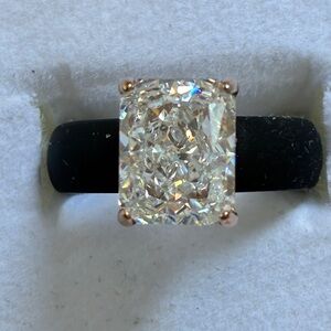 Elegant rose gold brilliant cut cz set in a black silicone band size 6